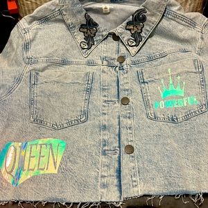 Ladies cropped jean jacket with powerful queen designs.